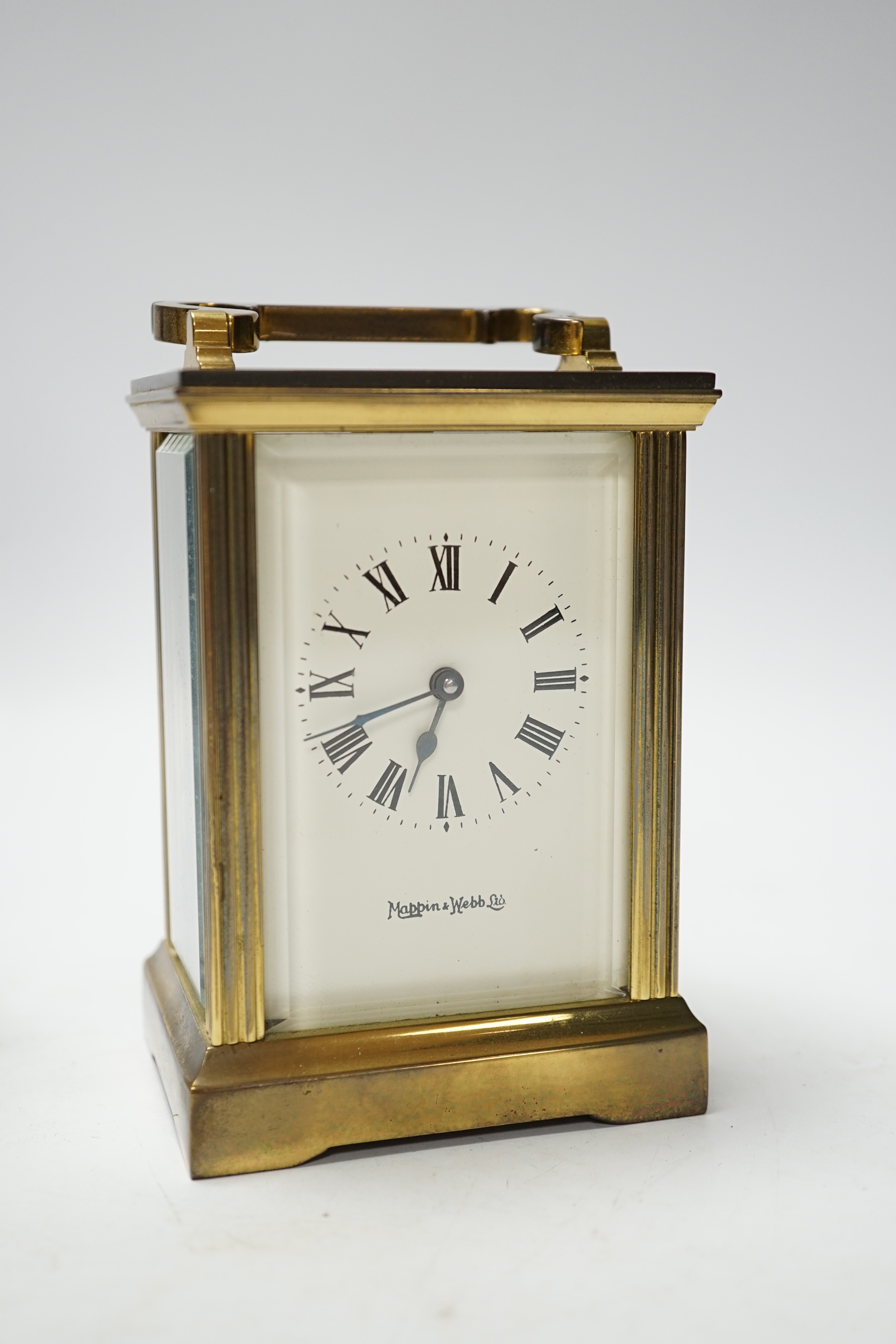 An Eric Gill sculpture of Madonna and child and a carriage timepiece, sculpture 23cm high